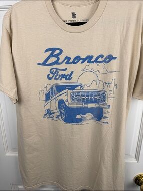 Junk Food Clothing Beige Tee with Blue Bronco Ford Graphic